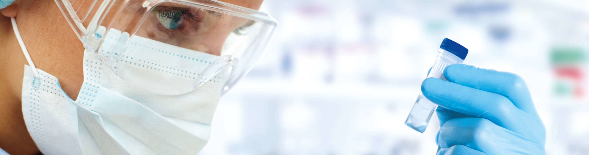 Female sientist holding a tube